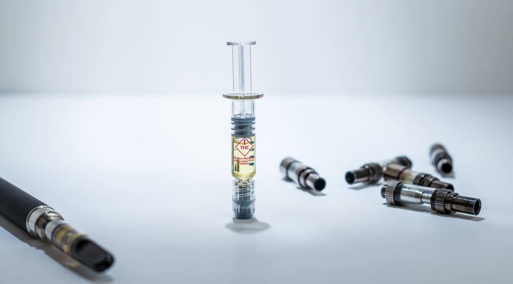 syringe filled with distillate
