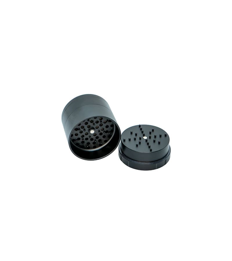 A black cylindrical grinder with a textured top and a separate, matching lid with spikes, on a white background.