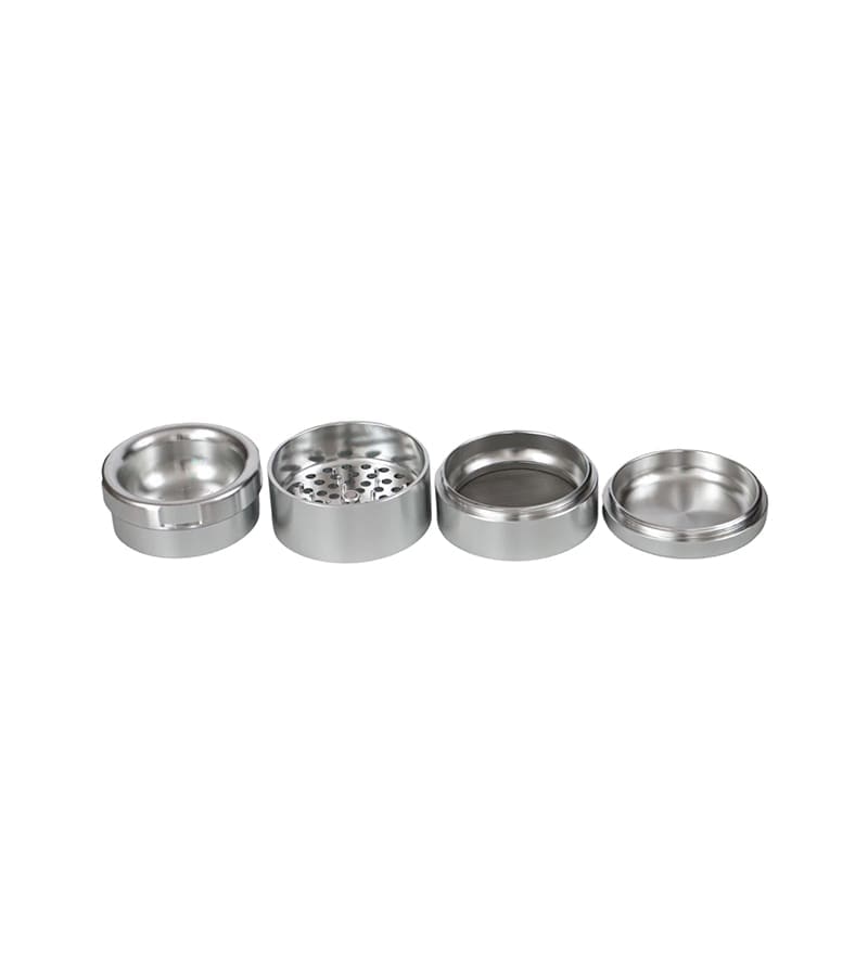 Four shiny, silver, cylindrical metal pieces of a disassembled grinder are arranged in a horizontal line.