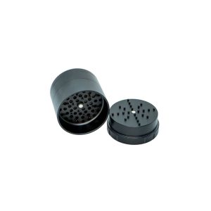 A black metal grinder is open, showing the top part with many small holes and the bottom with pegs.