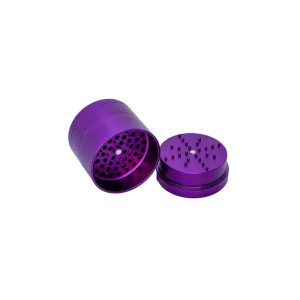 A shiny purple metal grinder is open, revealing a perforated screen and spiked grinding surface.