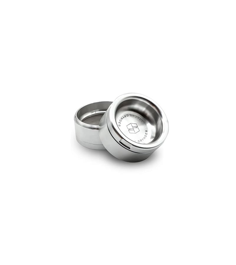 Two silver metal cylindrical grinders, one slightly behind the other, with "GRYNDER" text and a logo.