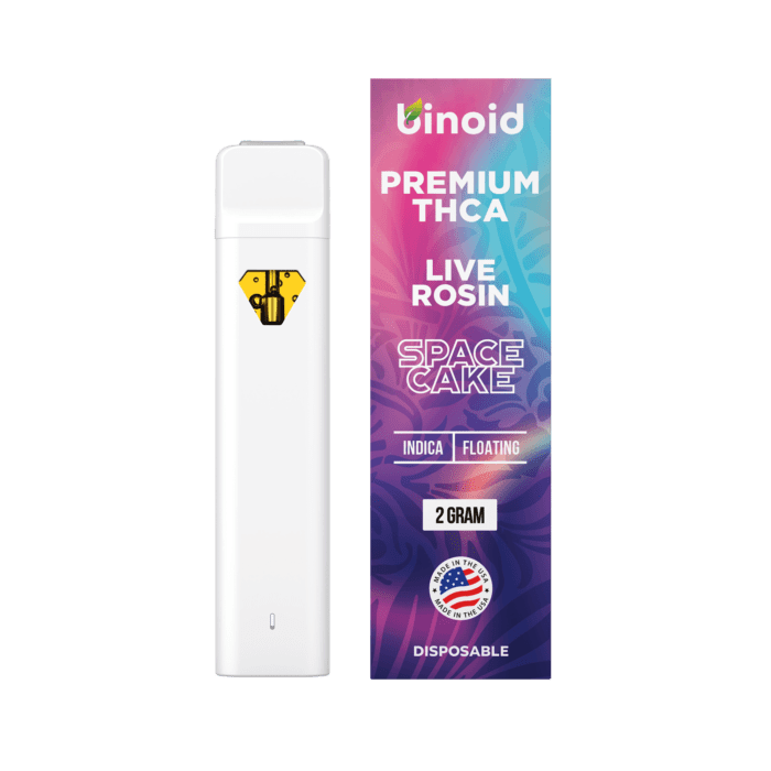 A white vape pen and a purple box with "BINIOD PREMIUM THCA LIVE ROSIN SPACE CAKE 2 GRAM" text.