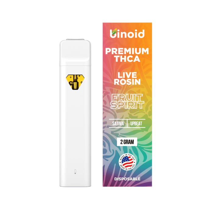 A white vape pen next to a colorful box labeled "PREMIUM THCA LIVE ROSIN FRUIT SPIRIT 2 GRAM."