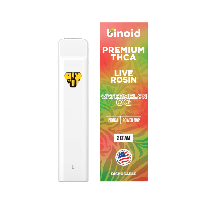 A white vape pen with a yellow diamond logo next to a box labeled "PREMIUM THCA LIVE ROSIN WATERMELON OG."