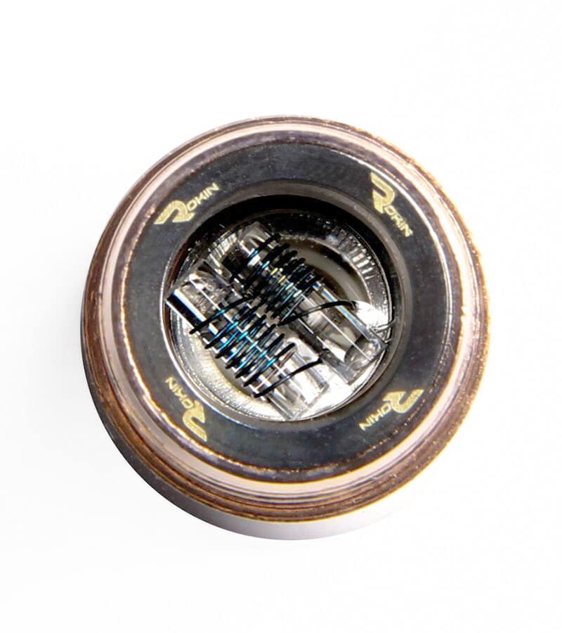 A top-down view of a vape atomizer with two coils and "ROHIN" text on the dark metal ring.