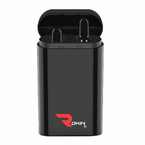 A black charging case for earbuds is open, revealing two black earbuds inside, with "ROKIN" in red.