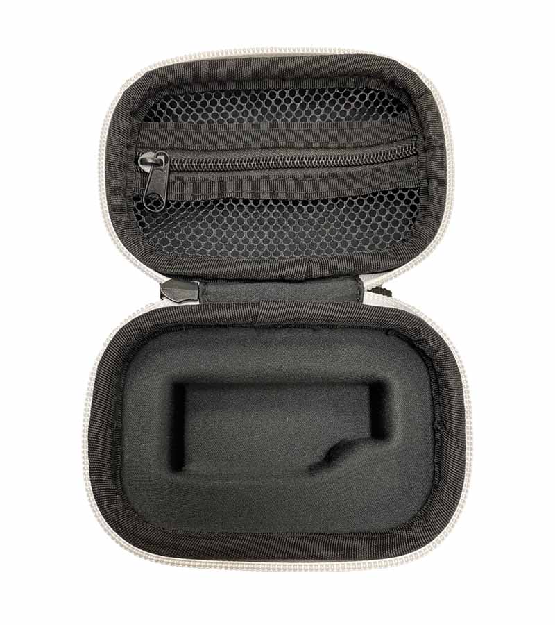 An open white and black hard case with a mesh zipper pocket and a custom-fit foam insert.