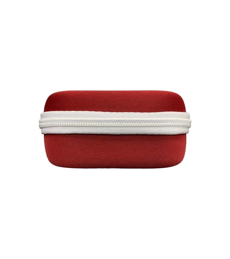 A red rectangular hard case with rounded edges features a white zipper running horizontally across its middle.