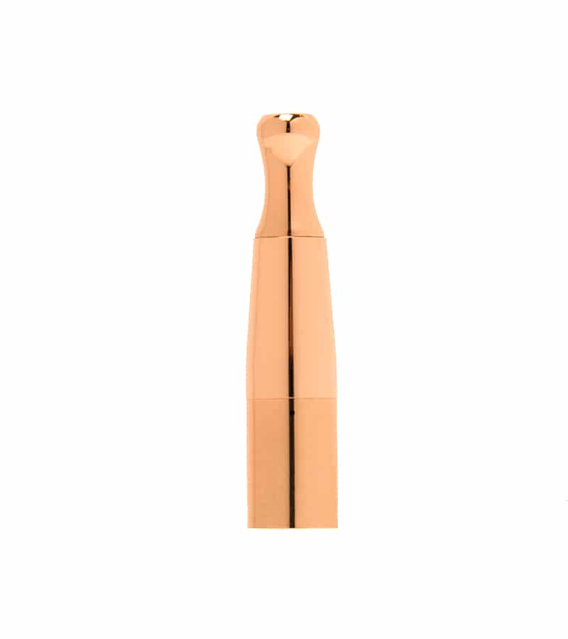 A rose gold, reflective, cylindrical object with a heart-shaped top stands vertically against a white background.