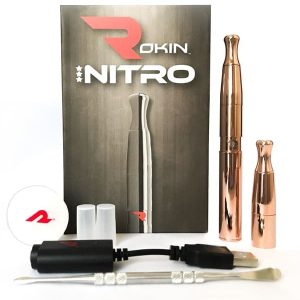 A Rokin Nitro vape kit, including a box, two rose gold vapes, a charger, and tools.
